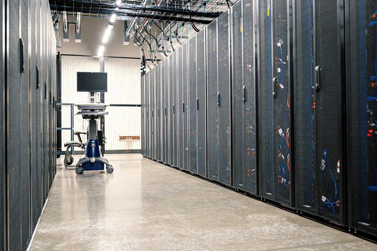 Modern data center corridor with server racks and computer equipment. Ideal for technology and IT concepts.